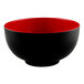 A black and red round melamine bowl with a white interior.