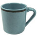 A blue coffee mug with a black rim and a cracked white surface and a blue handle.