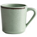 An Elite Global Solutions Hemlock Mug in green with a brown rim and handle.