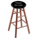 A Holland Bar Stool NHL wooden bar stool with a black seat.
