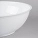 A close-up of a white Fineline high profile plastic catering bowl.