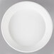 A white low profile plastic catering bowl with a black circular design on the rim.