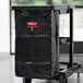 A black vinyl Rubbermaid janitor cart bag on a cart.
