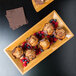 An American Metalcraft rectangular bamboo tray with muffins and berries on it.