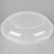 A clear plastic lid on a Fineline clear plastic catering bowl.