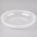 A clear plastic Fineline catering bowl lid on a clear plastic bowl.
