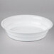 A white Fineline low profile plastic bowl with a lid on a white surface.