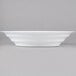 A white Fineline low profile catering bowl with a curved edge.