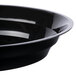 A close-up of a black Fineline low profile catering bowl.