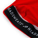A close up of a red Headsweats adjustable bandana.