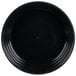 A black low profile plastic catering bowl with a spiral design on it.