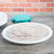 A white Fineline high rim plastic catering tray with cookies on it.