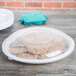 A Fineline white plastic catering tray with cookies on it.