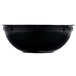 A close-up of a black Fineline high profile catering bowl with a white background.