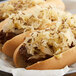 A hot dog with caraway seed and sauerkraut toppings.