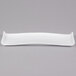 An American Metalcraft white rectangular porcelain serving platter with a curved edge.