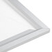 A white Aarco aluminum slide frame with a silver metal frame.