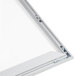 An Aarco aluminum slide frame with a silver border holding a white board.