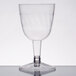 A Fineline clear plastic wine goblet with a stem.