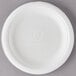 A white round Eco-Products compostable sugarcane plate with text on it.