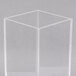 A clear plastic cube with a square base.