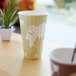 A World Art insulated paper hot cup on a table.