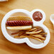 A white Eco-Products compostable sugarcane plate with a hot dog and french fries.