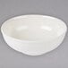 A white Thunder Group melamine Pho noodle bowl with a white rim on a gray surface.