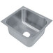 An Advance Tabco stainless steel undermount sink bowl with a square shape.