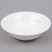 A white Arcoroc Zenix all purpose bowl with a white rim on a gray surface.