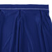 A royal blue table skirt with white bow tie pleats.