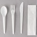 An Eco-Products white plastic cutlery kit with a fork, knife, spoon, and napkin.
