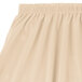 A cream Snap Drape shirred pleat table skirt with Velcro clips.