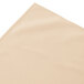 A cream Snap Drape shirred pleat table skirt on a white background.