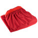 A red Snap Drape table skirt folded on a white background.