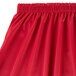 A red Snap Drape table skirt with shirred pleats.