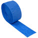 A roll of Creative Converting cobalt blue streamer paper on a white background.