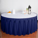A table with a royal blue Snap Drape table skirt with Velcro clips.
