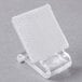 A clear plastic holder with a white surface on a stand.