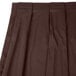 A brown box pleat table skirt with velcro clips.