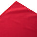 A red table skirt with a box pleat edge.