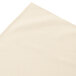 A bone Snap Drape shirred pleat table skirt on a white surface.