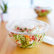 A salad in a clear plastic Eco-Products salad bowl with a clear lid.