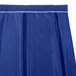 A royal blue table skirt with a box pleat and a white stripe.