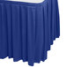 A royal blue box pleat table skirt with a white top.
