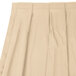 A cream Snap Drape table skirt with box pleats.