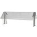 A clear plastic shelf with metal legs for an Advance Tabco buffet table.