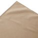 A beige Snap Drape box pleat table skirt.