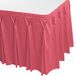 A dusty rose Snap Drape table skirt with pleated edges.