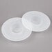 Two white plastic KitchenAid mixer bowl covers.